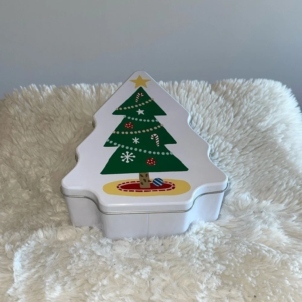Storage container with a Xmas tree in the front and shape made of metal